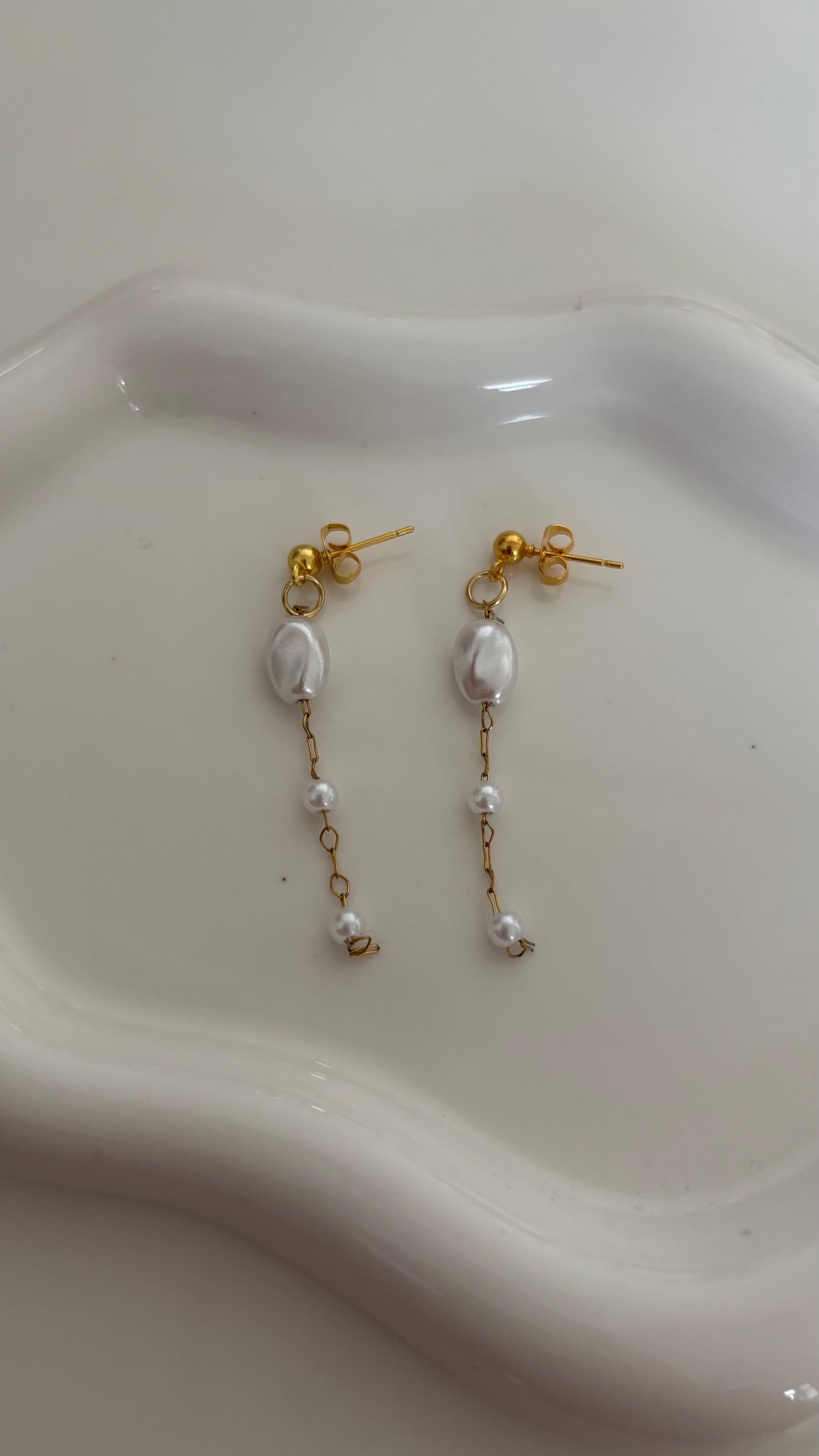 Gold pearl dangle earrings