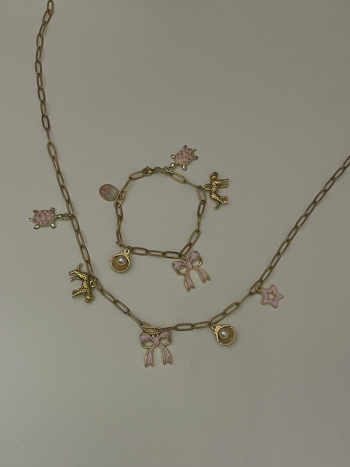 pink and gold bracelet and necklace set