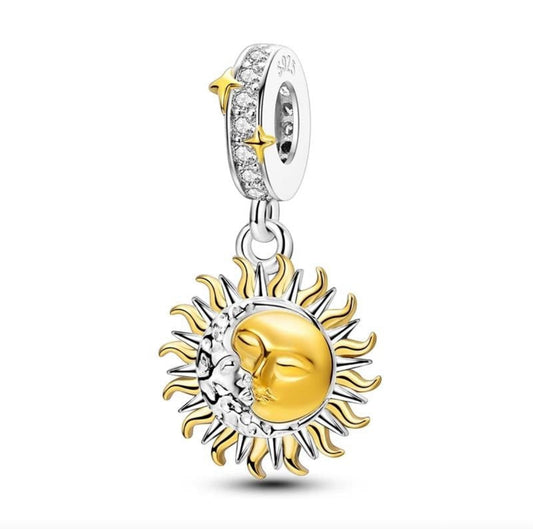 Gold and silver sun and moon charm