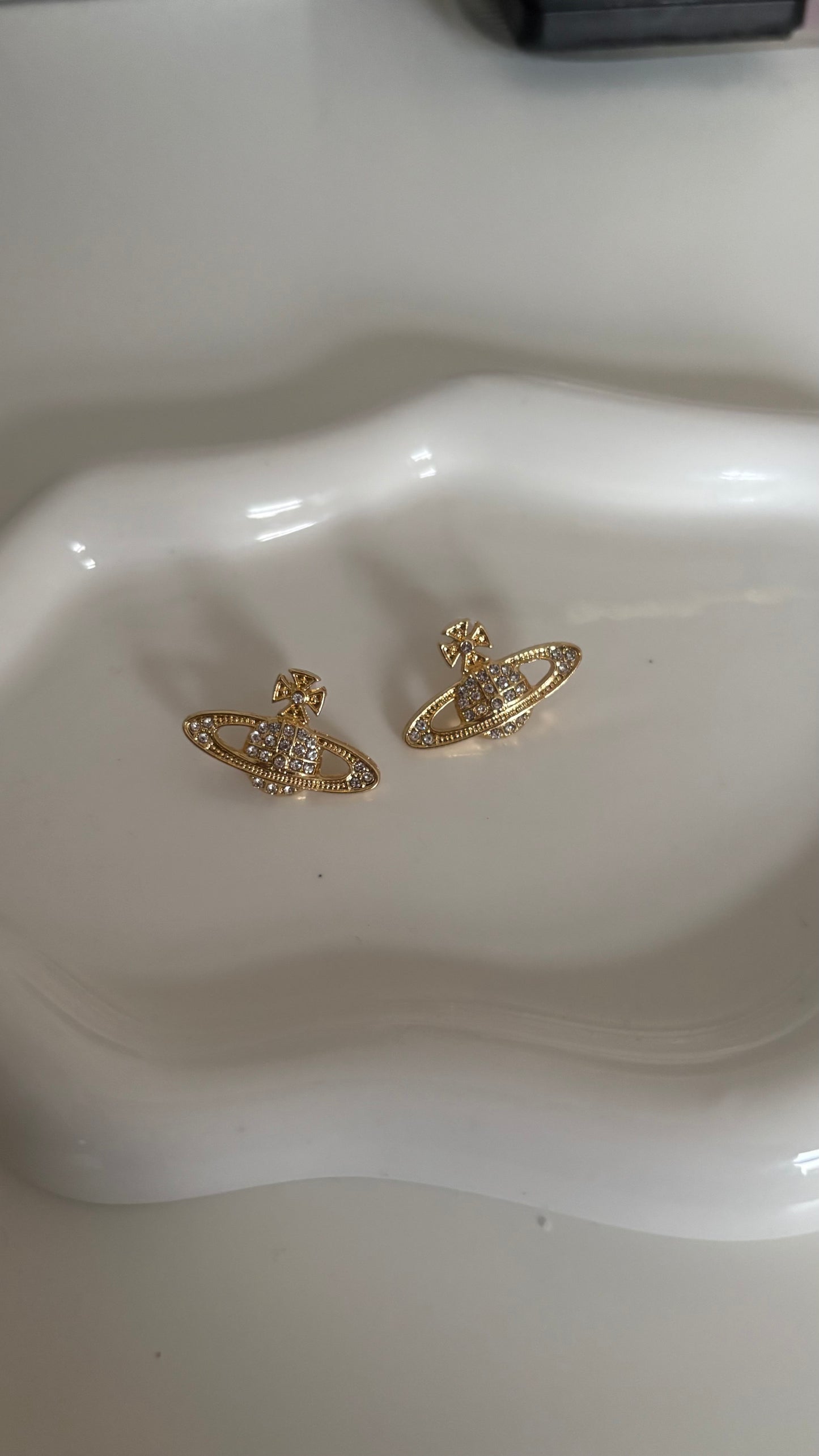 Gold Saturn earrings