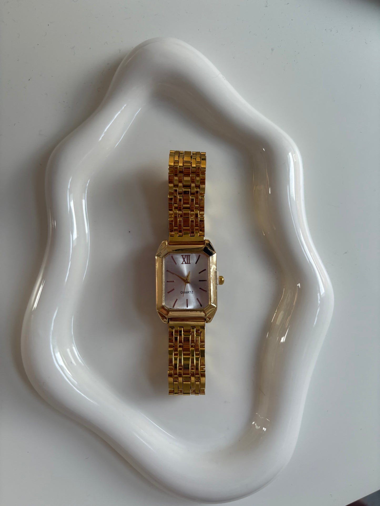 White faced gold watch