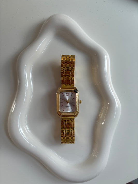 White faced gold watch