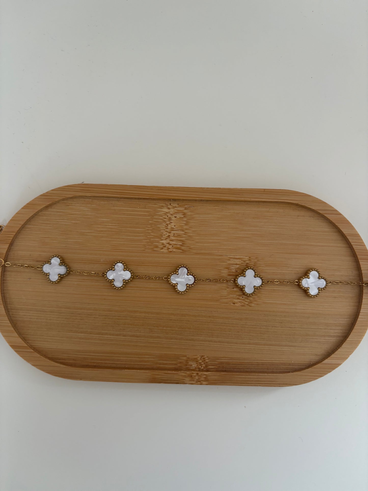 White and gold clover bracelet