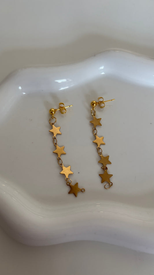 Gold star dangle earrings
