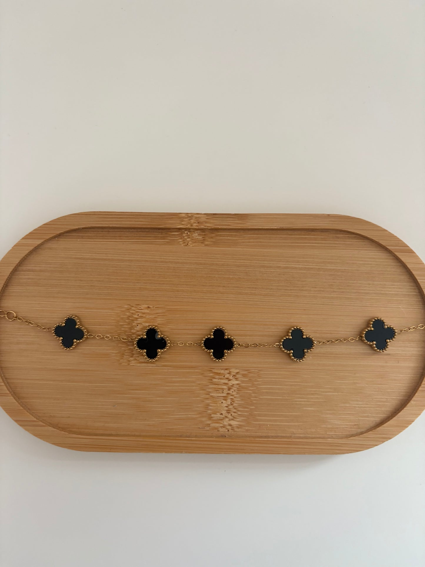 Black and gold clover bracelet