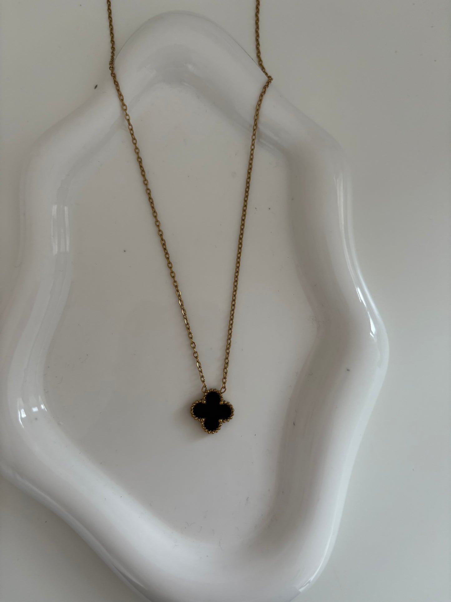 Black and gold clover necklace