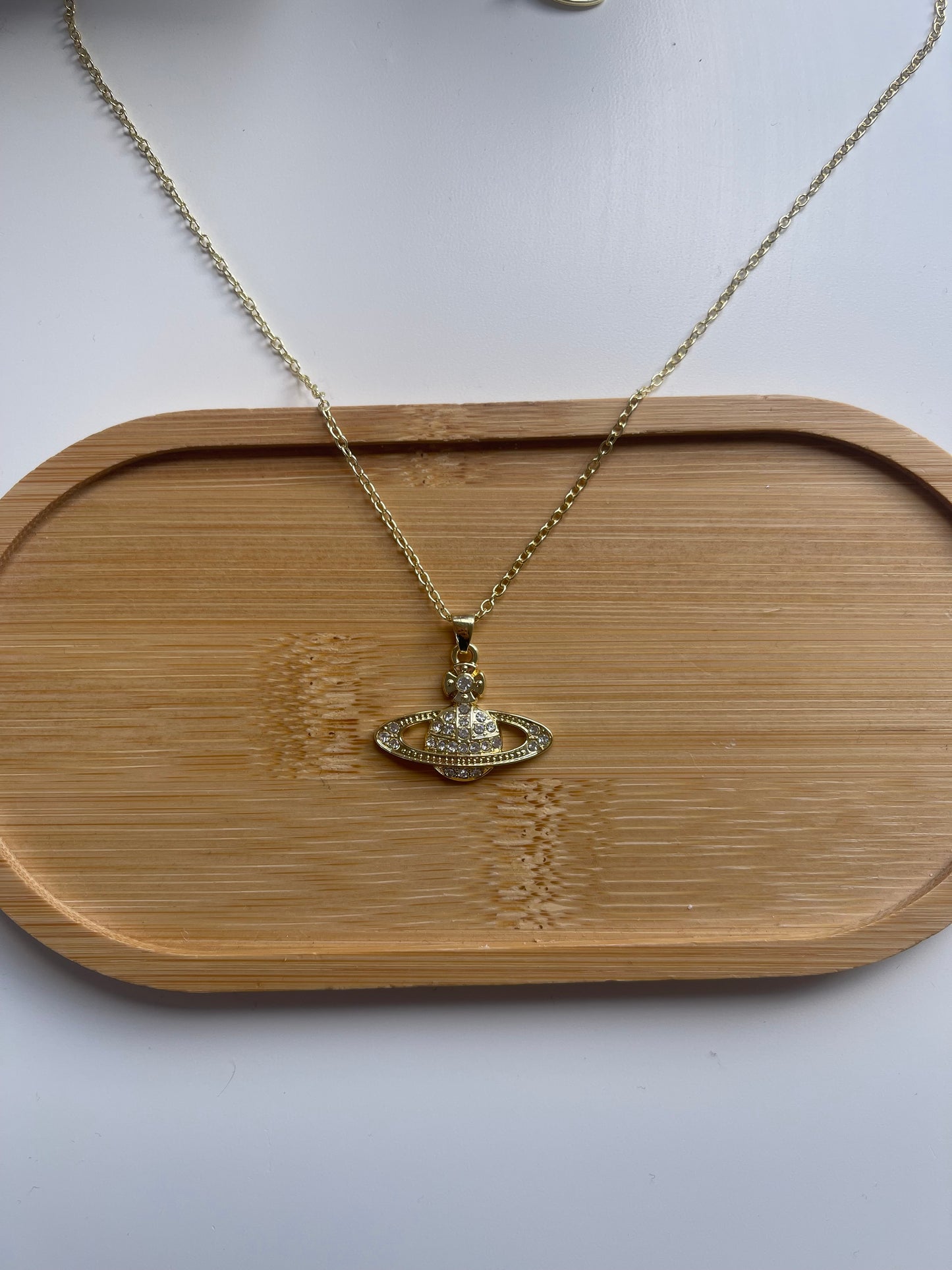 Gold Saturn necklace